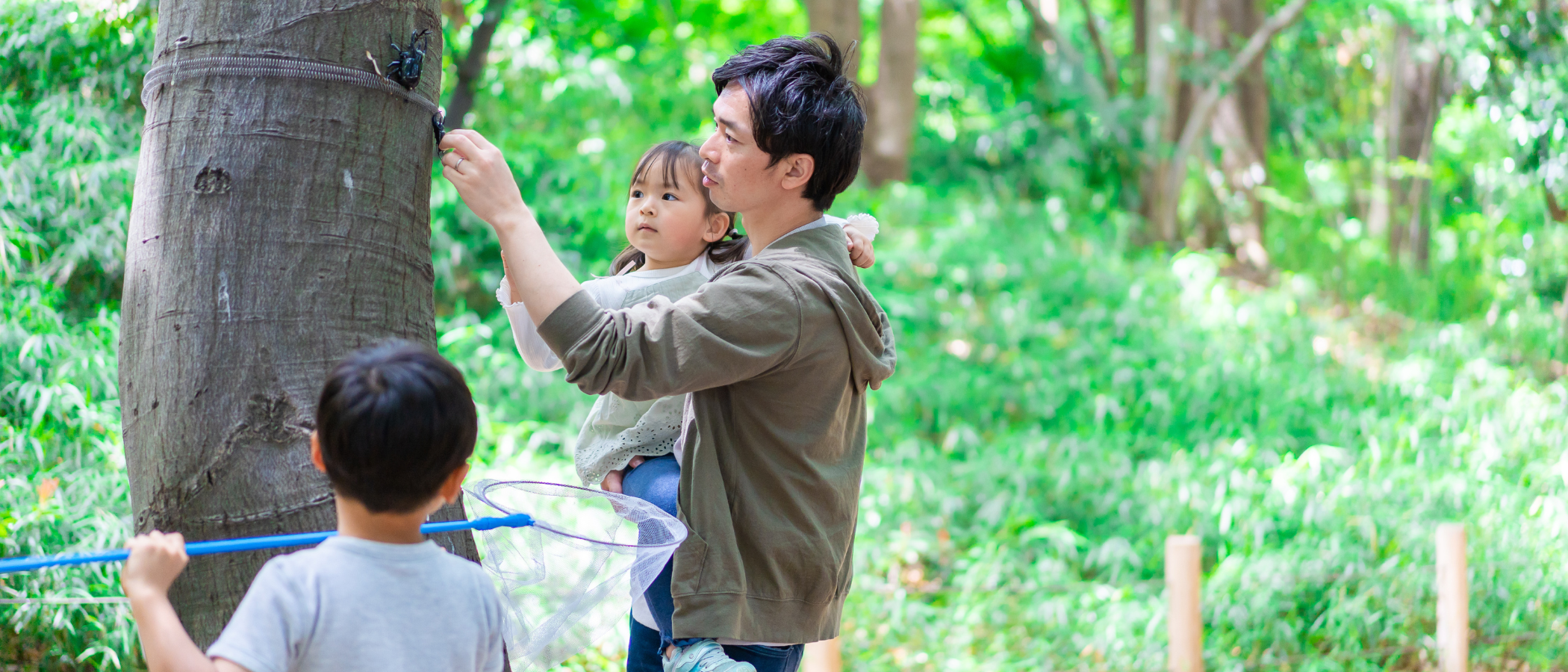 Family of garden lovers discussing on growing plants